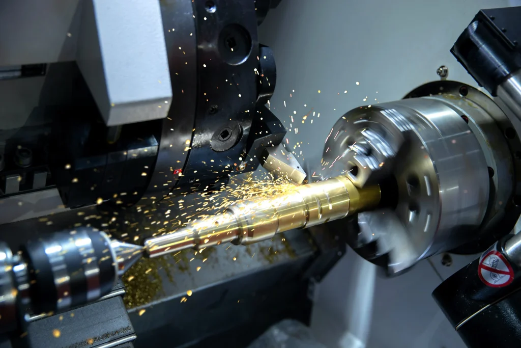 What is CNC Machining for the Solar Industry? 2 Precision CNC turning center machining a heavy-load tracker pivot pin. The turning process ensures the strict coaxiality and surface smoothness required to prevent uneven torque distribution and bearing wear within motorized single-axis tracking networks.