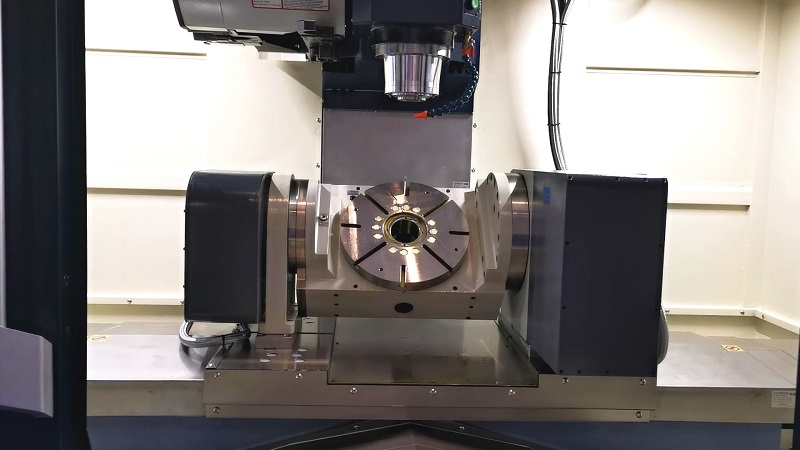 The Complete Guide to 5-Axis CNC Machining 3 Rotary table (C-Axis) integrated into a 5-axis CNC machine for precision machining.