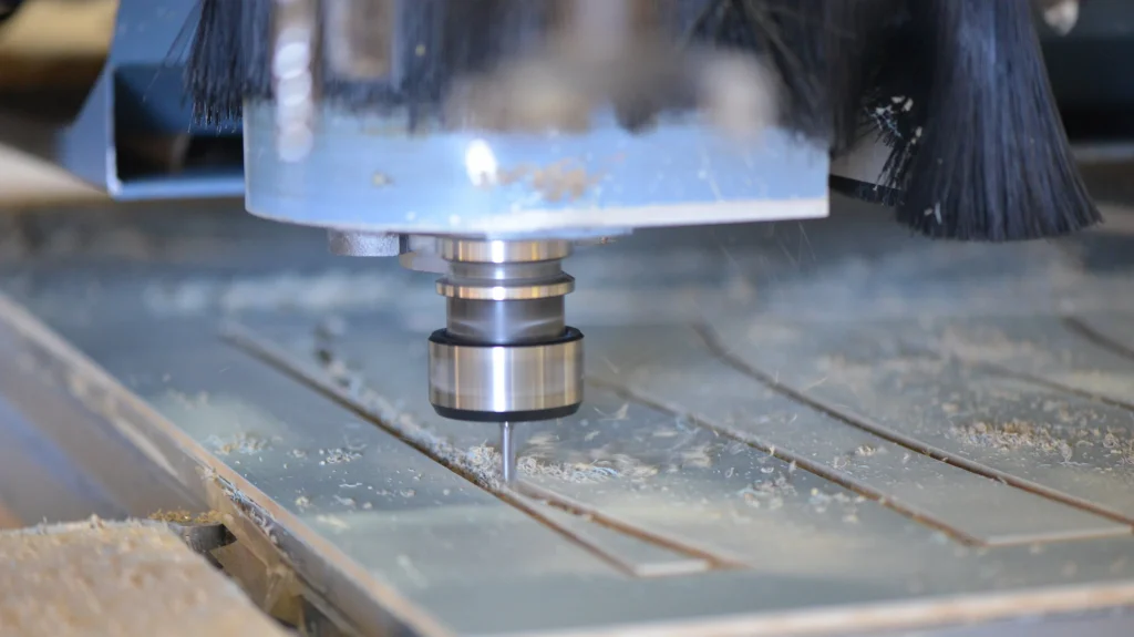 A Complete Guide to CNC Routing 1 A CNC router cutting a large sheet of wood, demonstrating precision and automated toolpaths.