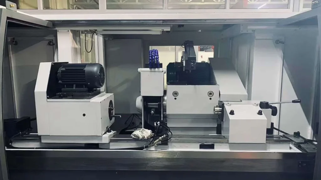 CNC Grinding: Definition, Types, Applications & Machine Overview 4 Modern CNC grinding machine displayed in a workshop, showing the grinding wheel, spindle, and control pane