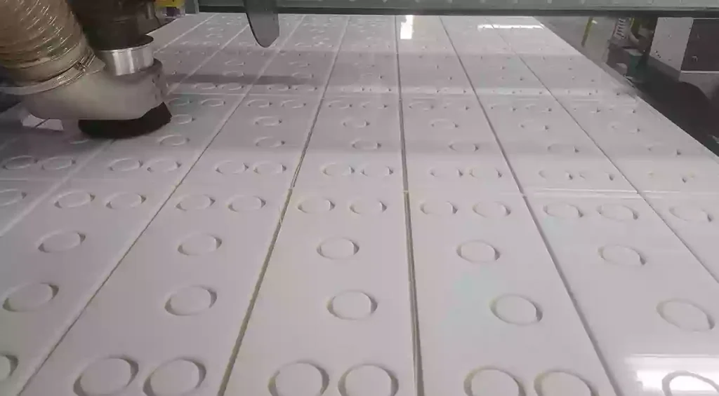 CNC Plastic Machining Guide: Materials, Design Rules and Cost Tips 1 High-speed CNC milling process of an engineering-grade polymer block, demonstrating precision material removal and thermal management.