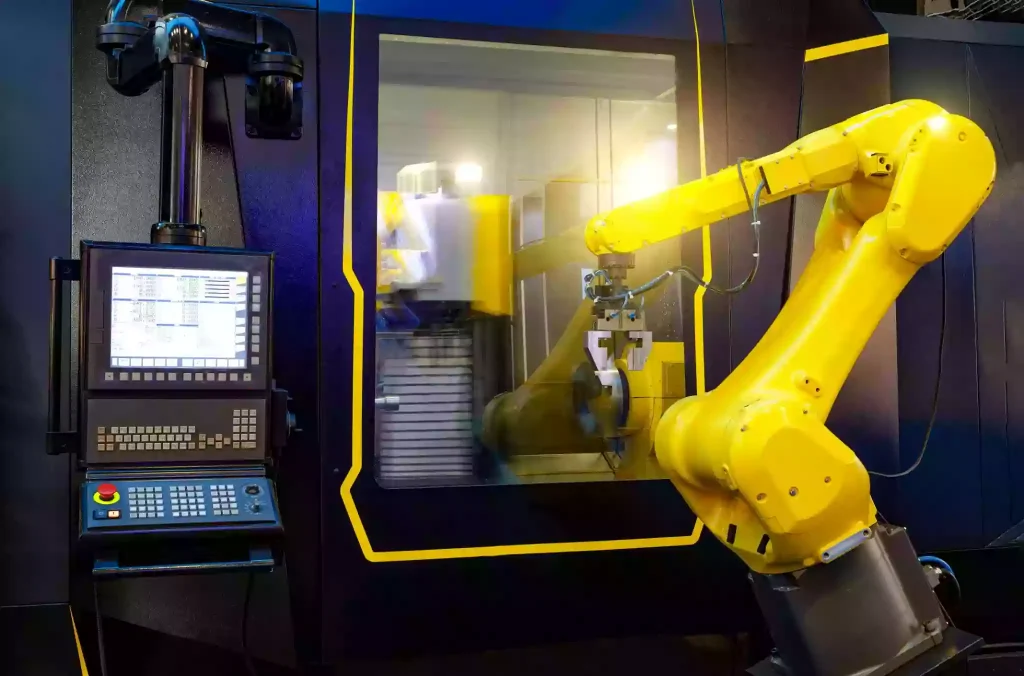 robotic hand machine tool at industrial manufacture factory working in conjunction with a numerically controlled machine