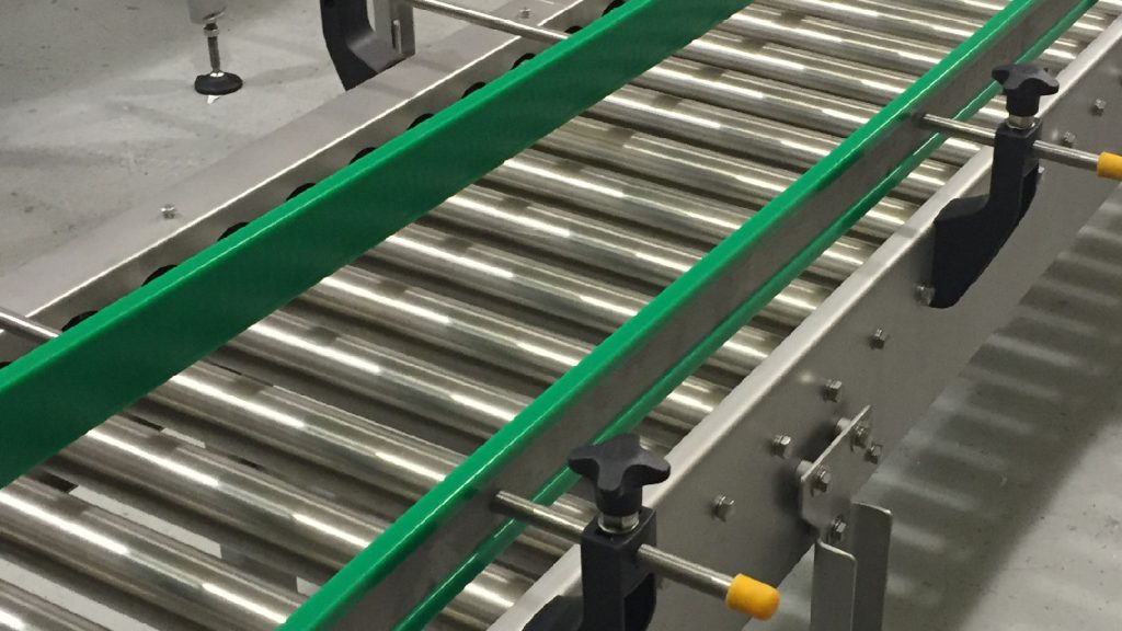 HDPE vs. UHMW-PE: Differences, Machining Challenges, and Selection Guide 2 UHMW-PE wear strips, conveyor chain guides, and sliding support components used in industrial material handling systems