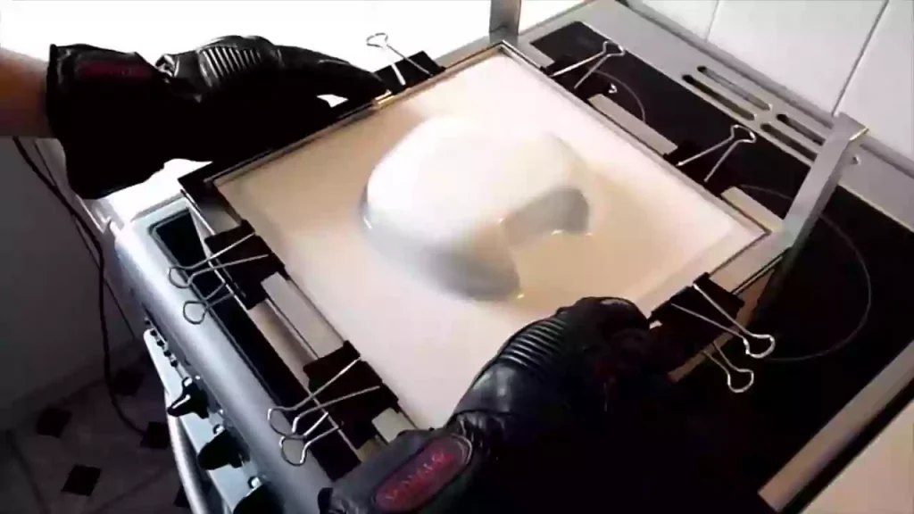 What is CNC Machining Polypropylene (PP)? 2 CNC machining of a polypropylene (PP) sheet secured on a vacuum table, ensuring uniform clamping force and preventing deformation during high-speed cutting.