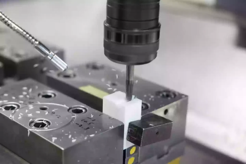 What is CNC Machining Polypropylene (PP)? 1 CNC machining process of polypropylene (PP) using high-speed milling, showing material removal with single-flute tooling and chip evacuation during cutting.