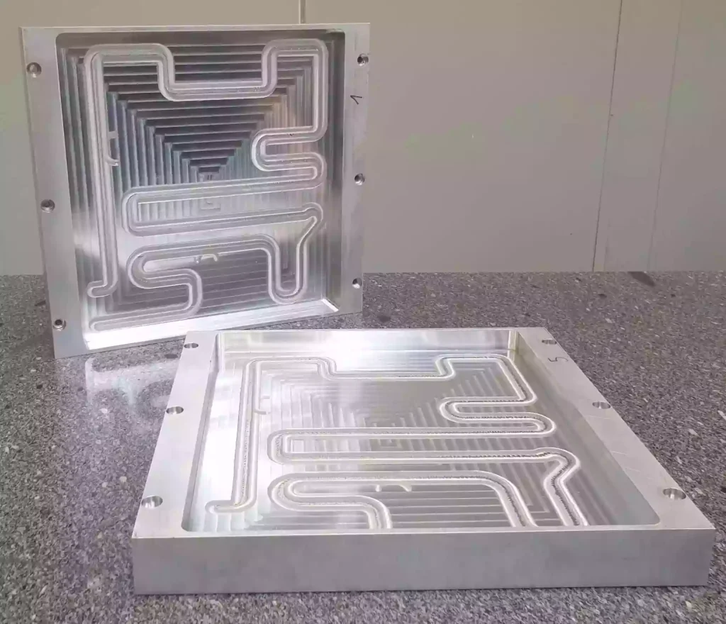 What is Battery CNC Machining? 2 High-speed CNC milling creates complex coolant channels inside aluminum cooling plates, ensuring uniform temperature distribution and improving battery performance and safety.