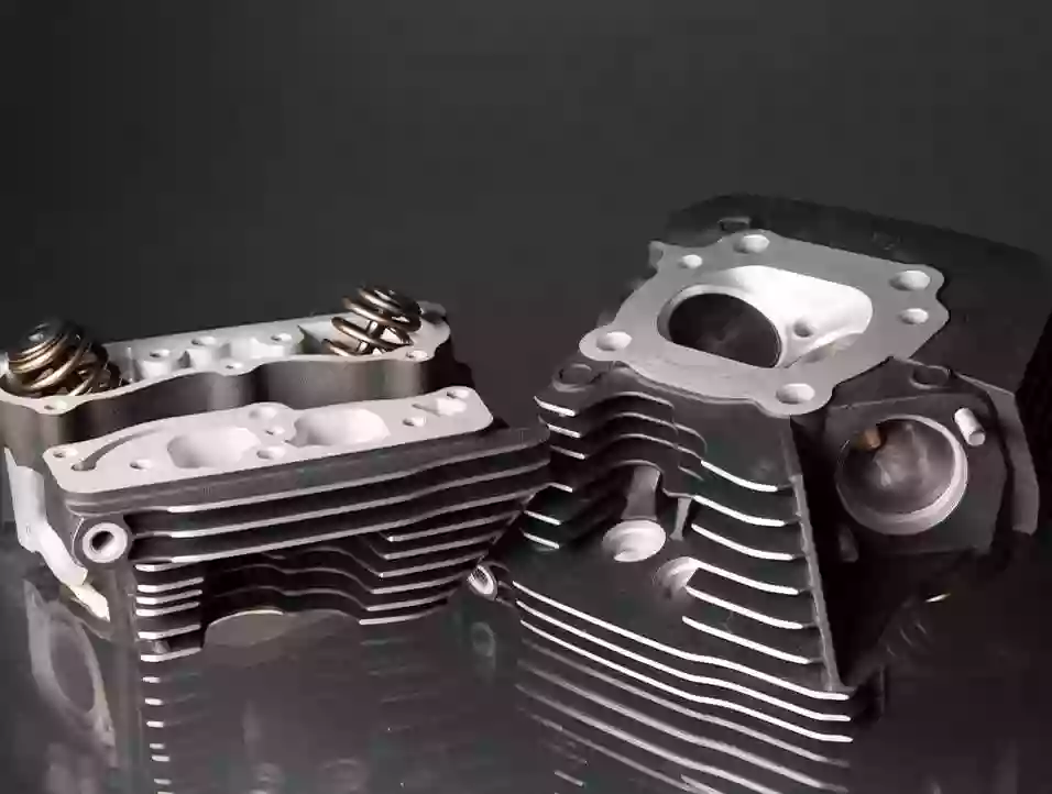 CNC Machined Motorcycle Parts: Design and Manufacturing Guide 1 A collection of CNC machined motorcycle parts, including triple clamps, rearsets, brake brackets, engine covers, and other precision components used in motorcycle engine, suspension, braking, and chassis systems.