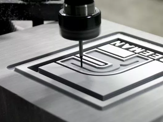 Types of Engraving 3 CNC engraving process creating precise markings on a custom metal component.